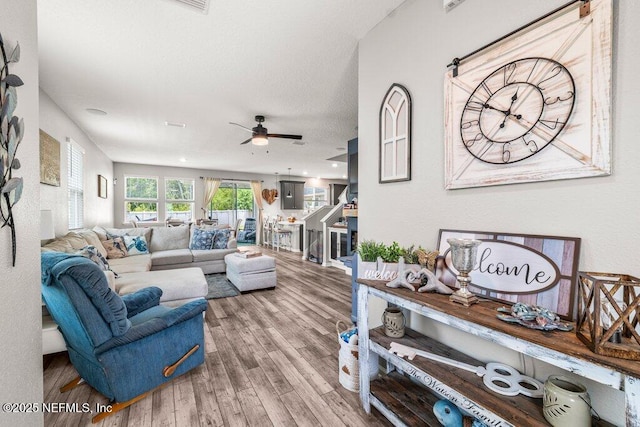 3283 Loblolly Pine Ct, Middleburg, FL 32068 - living area with wood finished floors and ceiling fan