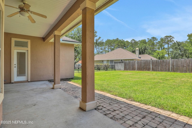 3559 Olympic Dr, Green Cove Springs, FL 32043 - fenced backyard with a patio area and a ceiling fan