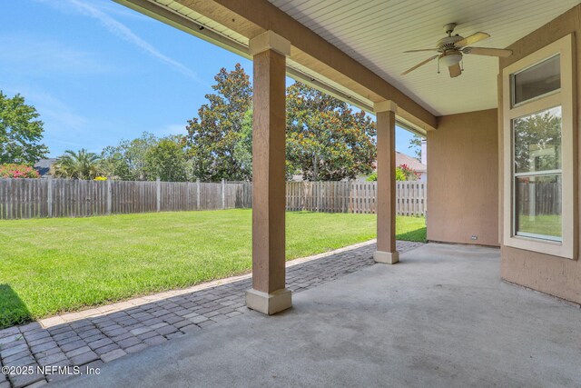 3559 Olympic Dr, Green Cove Springs, FL 32043 - fenced backyard featuring a ceiling fan and a patio area