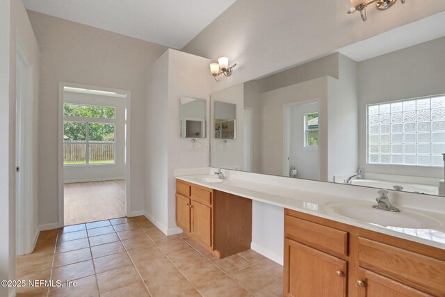3559 Olympic Dr, Green Cove Springs, FL 32043 - bathroom featuring double vanity, a bath, and tile patterned flooring