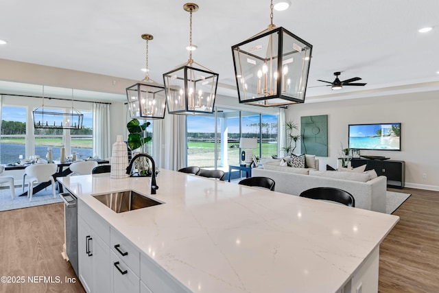 2443 Trailmark Dr, Saint Augustine, FL 32092 - kitchen featuring a chandelier, a kitchen island with sink, open floor plan, plenty of natural light, and recessed lighting