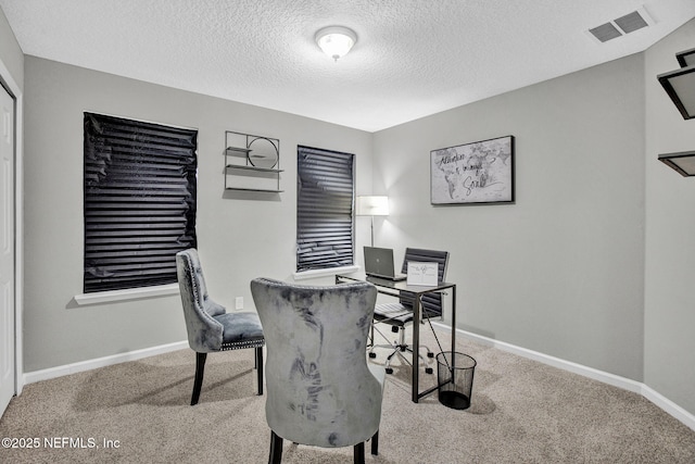 7442 Richardson Rd, Jacksonville, FL 32209 - carpeted office space featuring a textured ceiling and baseboards