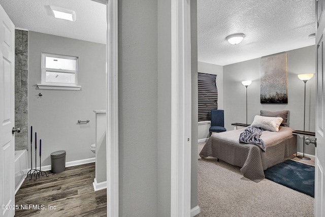 7442 Richardson Rd, Jacksonville, FL 32209 - bedroom with a textured ceiling and wood finished floors