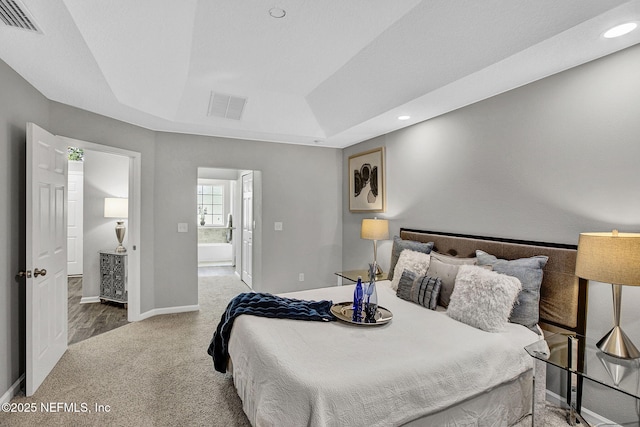 7442 Richardson Rd, Jacksonville, FL 32209 - bedroom with a tray ceiling, connected bathroom, carpet, and recessed lighting