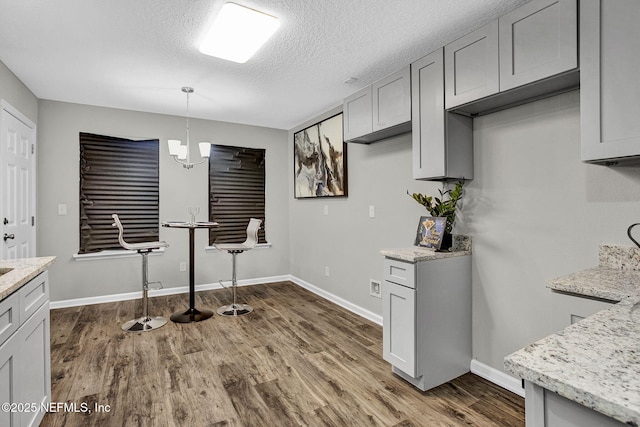 7442 Richardson Rd, Jacksonville, FL 32209 - unfurnished dining area featuring dark wood finished floors and a textured ceiling