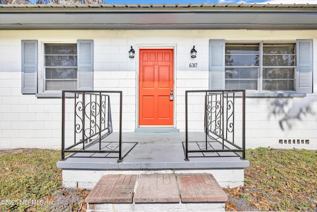 6317 Trout River Blvd, Jacksonville, FL 32219 - entrance to property with concrete block siding and covered porch