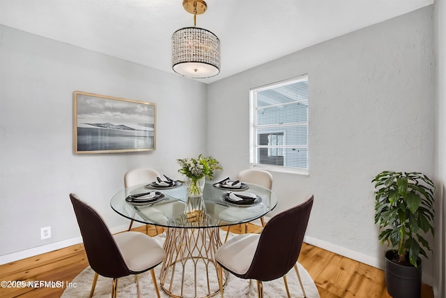 6317 Trout River Blvd, Jacksonville, FL 32219 - dining room with wood finished floors and a chandelier