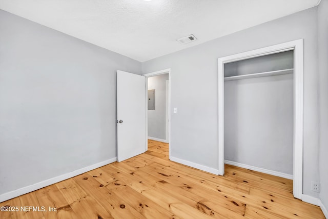 6317 Trout River Blvd, Jacksonville, FL 32219 - unfurnished bedroom featuring electric panel, wood-type flooring, and a closet