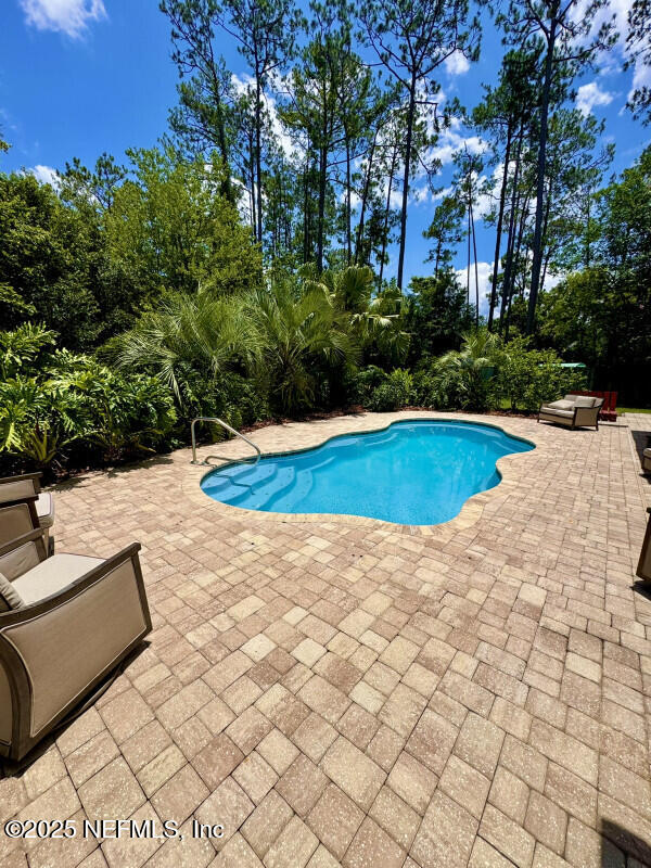 1703 Hunters Ridge Rd, Fleming Island, FL 32003 - outdoor pool featuring a patio