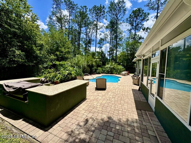 1703 Hunters Ridge Rd, Fleming Island, FL 32003 - view of pool featuring a patio and view of wooded area