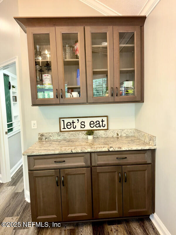 1703 Hunters Ridge Rd, Fleming Island, FL 32003 - bar with dark wood-style floors and baseboards