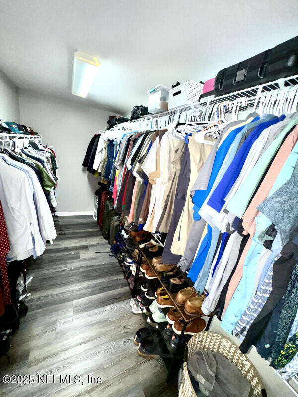 1703 Hunters Ridge Rd, Fleming Island, FL 32003 - walk in closet with wood finished floors