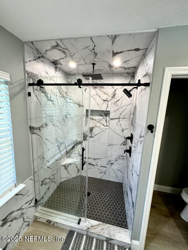 1703 Hunters Ridge Rd, Fleming Island, FL 32003 - full bathroom featuring toilet and a marble finish shower
