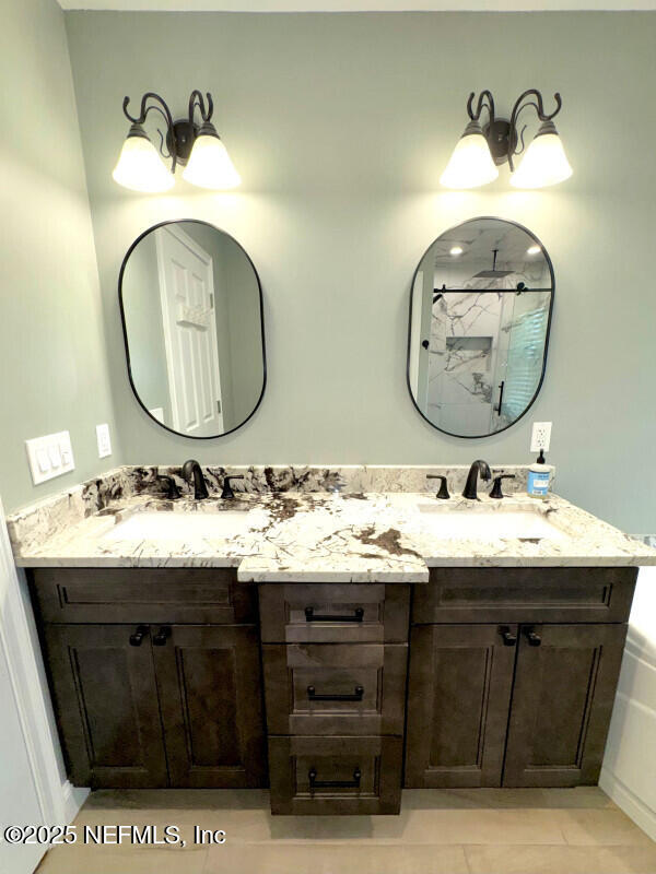 1703 Hunters Ridge Rd, Fleming Island, FL 32003 - full bath featuring double vanity, a shower, and tile patterned flooring