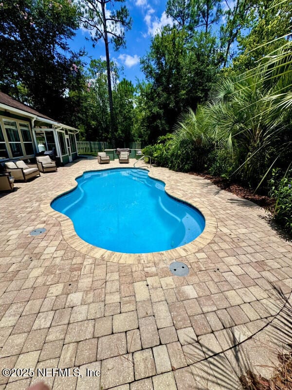1703 Hunters Ridge Rd, Fleming Island, FL 32003 - view of swimming pool featuring a patio area and view of scattered trees