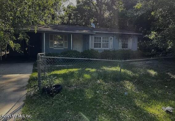 9125 Jefferson Ave, Jacksonville, FL 32208 - view of front facade featuring driveway