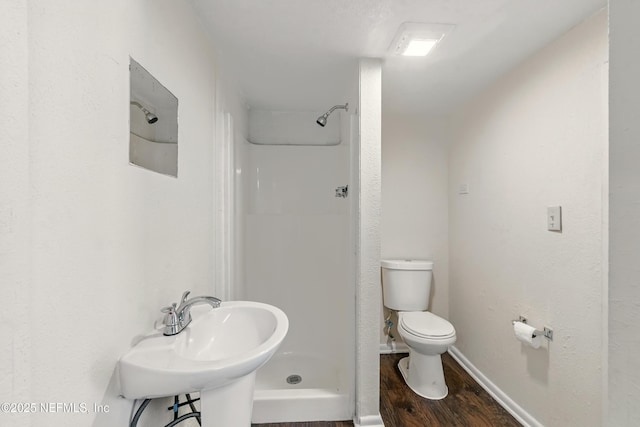 7120 Merrill Rd, Jacksonville, FL 32277 - full bath with a shower stall and wood finished floors
