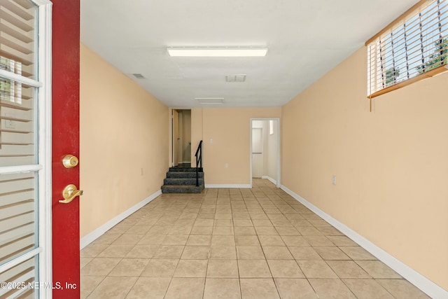 7120 Merrill Rd, Jacksonville, FL 32277 - basement featuring stairway and light tile patterned floors