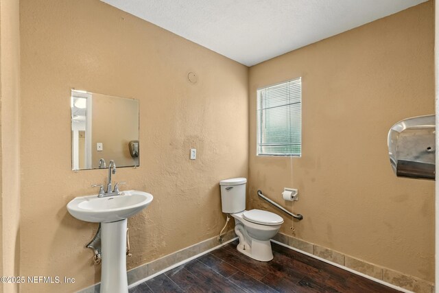 7120 Merrill Rd, Jacksonville, FL 32277 - half bath with wood finished floors and toilet