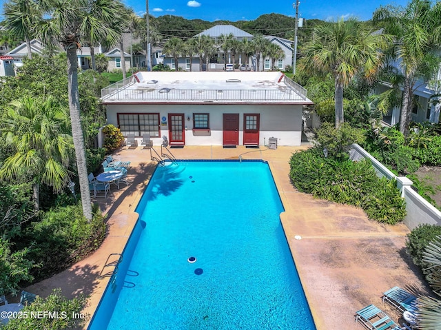1313 E Coast Dr, Atlantic Beach, FL 32233 - back of house featuring a patio area, an outdoor pool, and stucco siding