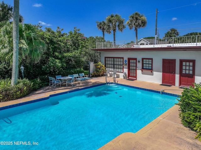 1313 E Coast Dr, Atlantic Beach, FL 32233 - outdoor pool with a patio and french doors