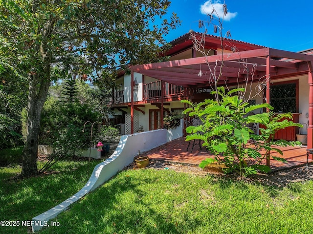 1313 E Coast Dr, Atlantic Beach, FL 32233 - back of property featuring a lawn and stucco siding