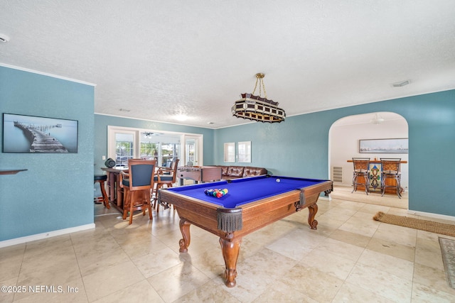 2910 Lake Shore Blvd, Jacksonville, FL 32210 - recreation room with arched walkways, pool table, a textured ceiling, and crown molding