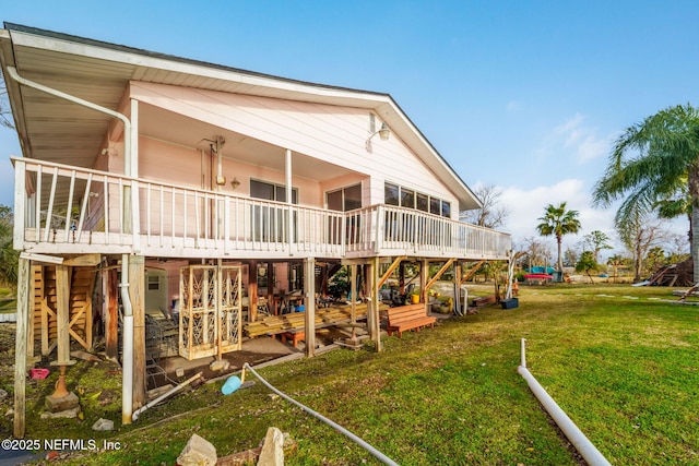 2910 Lake Shore Blvd, Jacksonville, FL 32210 - rear view of house featuring a wooden deck and a lawn
