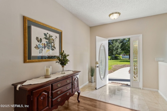96031 Glen Laurel Ct, Yulee, FL 32097 - entryway featuring a textured ceiling and baseboards