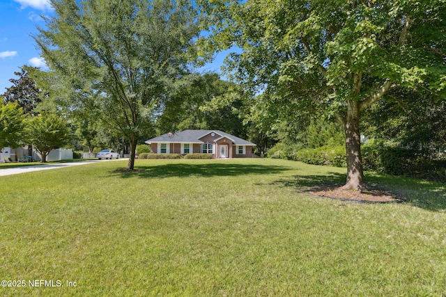 96031 Glen Laurel Ct, Yulee, FL 32097 - ranch-style home featuring a front lawn