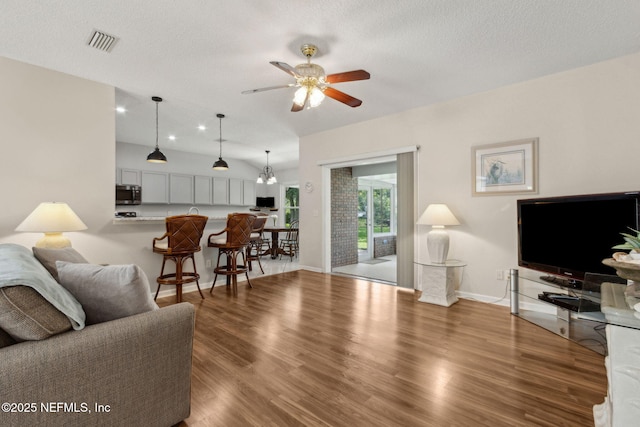 96031 Glen Laurel Ct, Yulee, FL 32097 - living room featuring ceiling fan, wood finished floors, and a textured ceiling