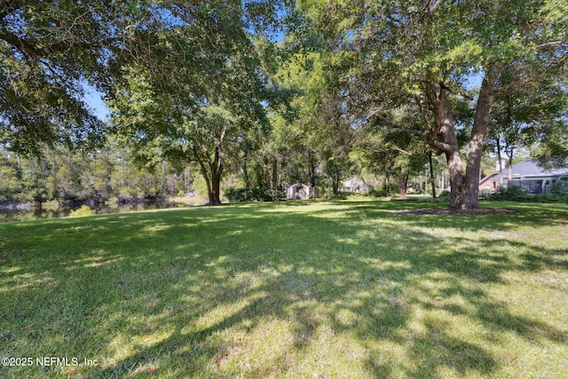 96031 Glen Laurel Ct, Yulee, FL 32097 - view of grassy yard with a shed