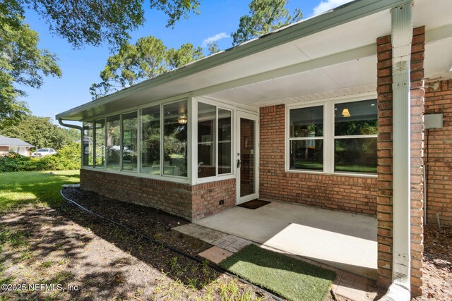 96031 Glen Laurel Ct, Yulee, FL 32097 - view of patio / terrace with a sunroom