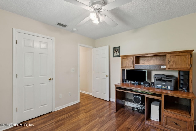96031 Glen Laurel Ct, Yulee, FL 32097 - office space featuring dark wood-style flooring, a ceiling fan, and a textured ceiling