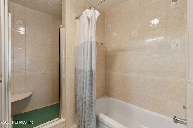 96031 Glen Laurel Ct, Yulee, FL 32097 - bathroom with tiled shower / bath combo and a textured ceiling