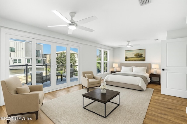 82 Cortez Ave, Saint Augustine, FL 32080 - bedroom featuring access to exterior, wood finished floors, and a ceiling fan