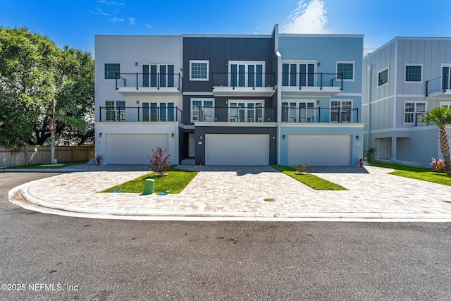 82 Cortez Ave, Saint Augustine, FL 32080 - view of front facade with a garage and decorative driveway
