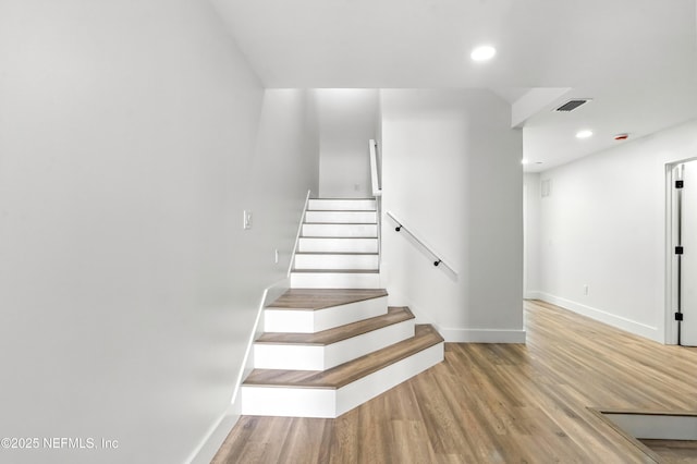 82 Cortez Ave, Saint Augustine, FL 32080 - staircase with wood finished floors and recessed lighting