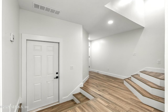 82 Cortez Ave, Saint Augustine, FL 32080 - entrance foyer with stairway, recessed lighting, and wood finished floors