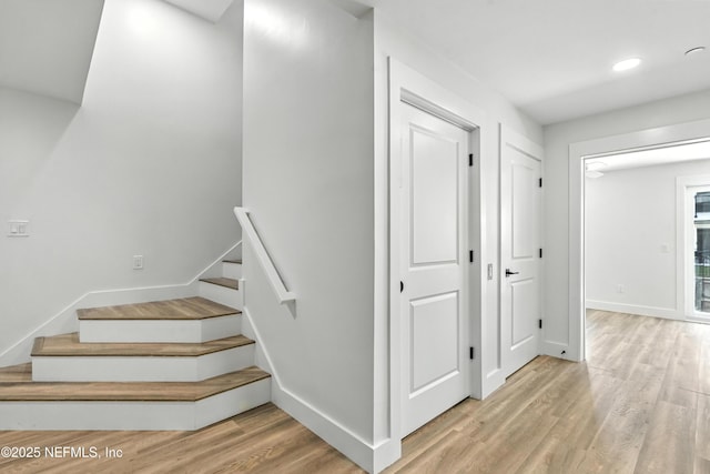82 Cortez Ave, Saint Augustine, FL 32080 - staircase with wood finished floors and recessed lighting