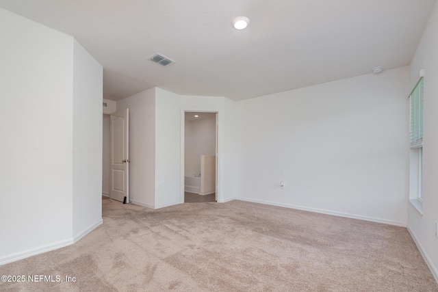 12 Wood Amber Ln, Palm Coast, FL 32164 - spare room with carpet and baseboards