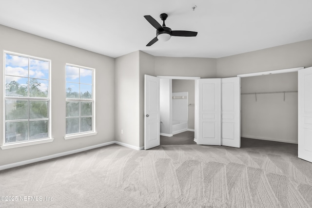 8290 Gate Pkwy Unit 1115, Jacksonville, FL 32216 - unfurnished bedroom featuring light colored carpet, a closet, ceiling fan, and ensuite bath