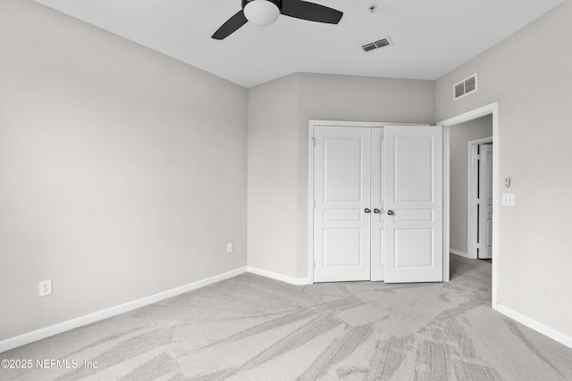 8290 Gate Pkwy Unit 1115, Jacksonville, FL 32216 - unfurnished bedroom with carpet flooring, a closet, and a ceiling fan
