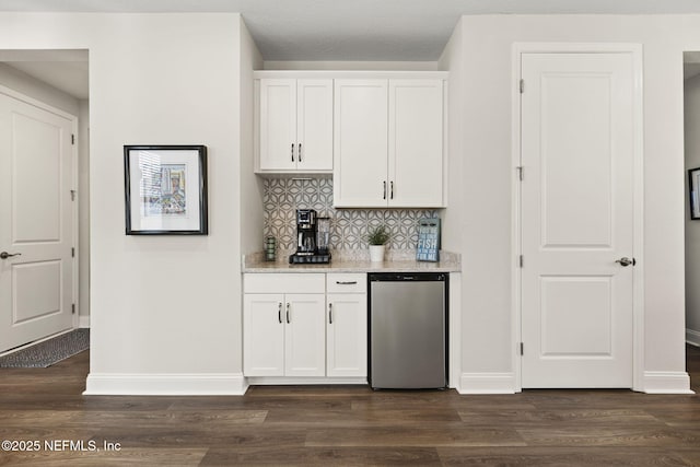 393 Ladyslipper Dr, Saint Johns, FL 32259 - kitchen featuring refrigerator, dark wood-type flooring, tasteful backsplash, and white cabinets