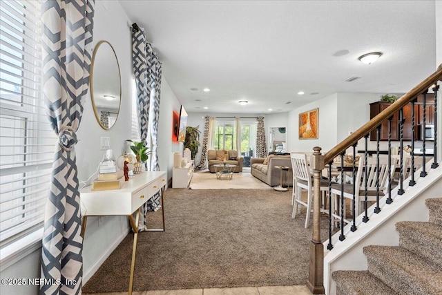 737 Windermere Way, Saint Augustine, FL 32095 - carpeted living area with stairway and recessed lighting