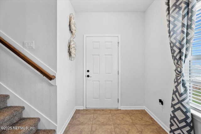 737 Windermere Way, Saint Augustine, FL 32095 - entrance foyer with plenty of natural light, stairs, and light tile patterned flooring
