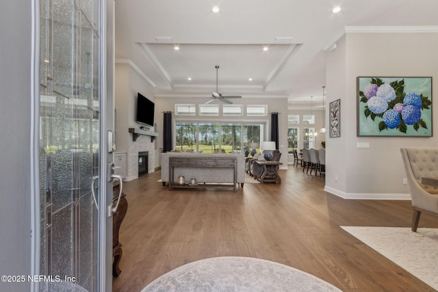 95049 Wild Cherry Dr, Fernandina Beach, FL 32034 - entrance foyer featuring a ceiling fan, a raised ceiling, wood finished floors, recessed lighting, and crown molding