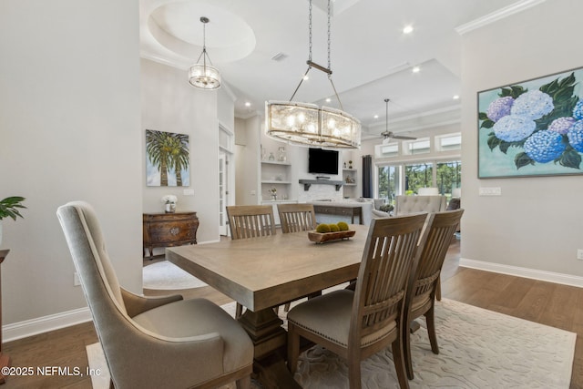 95049 Wild Cherry Dr, Fernandina Beach, FL 32034 - dining space with dark wood-type flooring, crown molding, recessed lighting, and ceiling fan