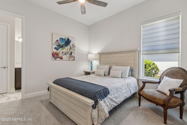 95049 Wild Cherry Dr, Fernandina Beach, FL 32034 - bedroom featuring ceiling fan, ensuite bath, light marble finish floors, and light colored carpet