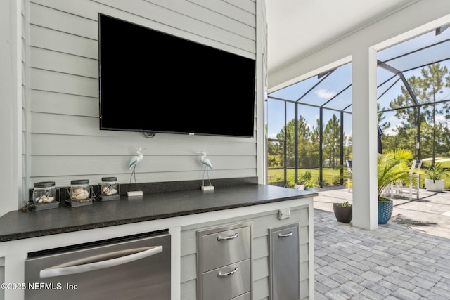 95049 Wild Cherry Dr, Fernandina Beach, FL 32034 - view of patio / terrace featuring a lanai and an outdoor kitchen